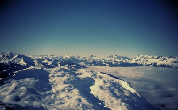 Snowy mountains cloud valley